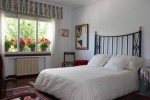 Llit o llits en una habitació de Casa Amalia - En el corazón verde de Cantabria!!