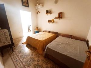 Postel nebo postele na pokoji v ubytování Dhara House Malta