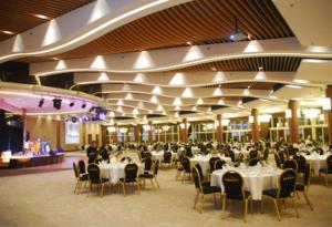 a large banquet hall with white tables and chairs at ALANYA GOLD CİTY in Alanya