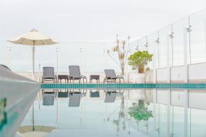 Bazén v ubytování Diff Hotel - by Easy Hotéis nebo v jeho okolí