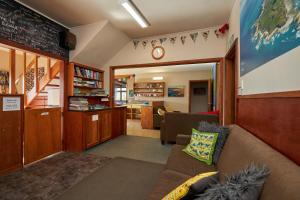 
a living room filled with furniture and a couch at Dolphin Lodge in Kaikoura
