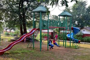 a group of children playing on a playground at Nature Trails Kundalika, Kolad in Kolād