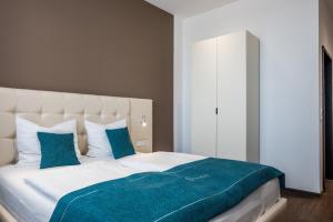 Postel nebo postele na pokoji v ubytování RheinCity Hotel & Boardinghouse