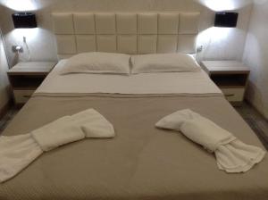 Ένα ή περισσότερα κρεβάτια σε δωμάτιο στο Hotel Chaika