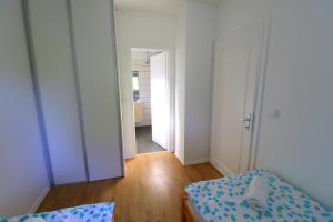 Posteľ alebo postele v izbe v ubytovaní Friends & Family Apartmanok Velence