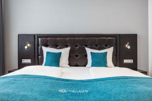Postel nebo postele na pokoji v ubytování RheinCity Hotel & Boardinghouse