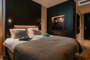 Katil atau katil-katil dalam bilik di Residence Oude Haven kamer met sauna
