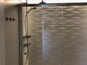 a shower with a glass door in a bathroom at Apartamento Adrover in Cala Millor +17 photos