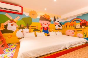 Postel nebo postele na pokoji v ubytování 閣樂親子旅宿Kids Fun Hotel