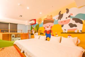 Postel nebo postele na pokoji v ubytování 閣樂親子旅宿Kids Fun Hotel