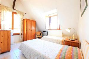 Una cama o camas en una habitación de Iris, les Gîtes de Carlux