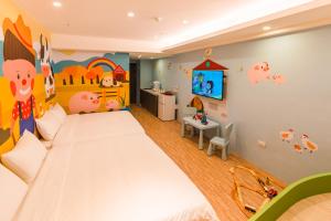 Postel nebo postele na pokoji v ubytování 閣樂親子旅宿Kids Fun Hotel
