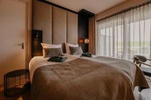 מיטה או מיטות בחדר ב-Residence Oude Haven room with terrace