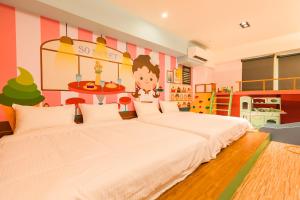 Postel nebo postele na pokoji v ubytování 閣樂親子旅宿Kids Fun Hotel