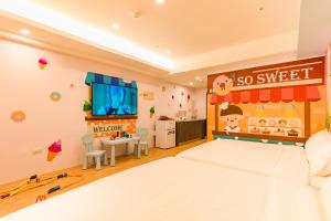 Postel nebo postele na pokoji v ubytování 閣樂親子旅宿Kids Fun Hotel