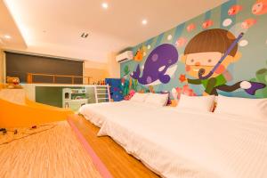 Postel nebo postele na pokoji v ubytování 閣樂親子旅宿Kids Fun Hotel