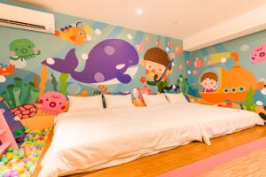 Postel nebo postele na pokoji v ubytování 閣樂親子旅宿Kids Fun Hotel