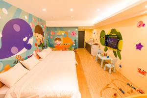 Postel nebo postele na pokoji v ubytování 閣樂親子旅宿Kids Fun Hotel