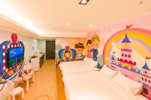 Postel nebo postele na pokoji v ubytování 閣樂親子旅宿Kids Fun Hotel