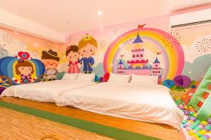 Postel nebo postele na pokoji v ubytování 閣樂親子旅宿Kids Fun Hotel