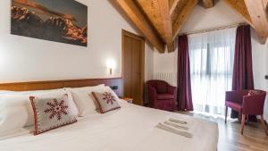 Postel nebo postele na pokoji v ubytování Residence Pizzo Scalino