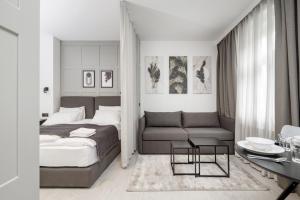 Postel nebo postele na pokoji v ubytování Apartamenty L11, Limanowskiego