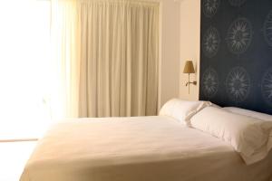 Cama o camas de una habitación en Hotel Marfil
