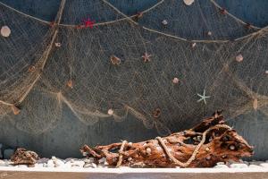 a close up of a net and some rocks at Makis studios By La skala Vista in Skala Kefalonias