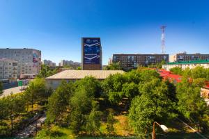 a view of a city with a clock tower at Nikhouse apartment Krasniy put' in Omsk