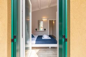 a bedroom with a bed and a window at La Nuova Corte Verona in Verona