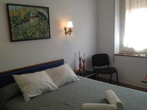 Postel nebo postele na pokoji v ubytování Hotel Comodoro