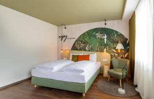 Postelja oz. postelje v sobi nastanitve The Weekend Hotel