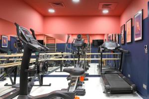 a gym with treadmills and cardio machines at Aparthotel Adagio Paris Suresnes Longchamp in Suresnes