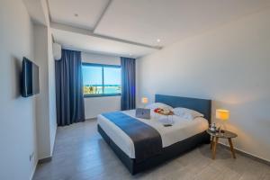 Postel nebo postele na pokoji v ubytování Asilah 32 + 39 fotografií