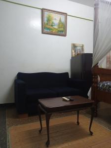 a living room with a couch and a coffee table at SAFI Apartment in Mombasa