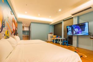 TV a/nebo společenská místnost v ubytování 閣樂親子旅宿Kids Fun Hotel