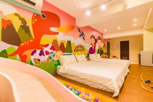 Postel nebo postele na pokoji v ubytování 閣樂親子旅宿Kids Fun Hotel