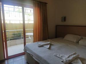 Postel nebo postele na pokoji v ubytování Wassermann Hotel