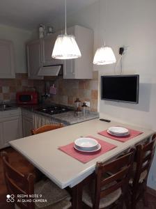 A kitchen or kitchenette at Agula Relais appartamento