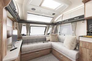 an interior view of an rv with a couch at Pinetum Gardens Retreats in St Austell