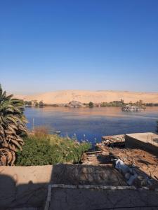 a view of a body of water in the desert at Aswan Nubian House in Aswan