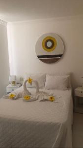Cama o camas de una habitación en Mandakaru Residence Flats da Jô