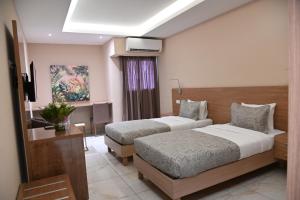 Postel nebo postele na pokoji v ubytování HOTEL ASTRAL