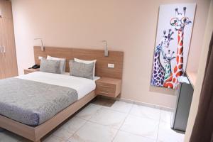 Ein Bett oder Betten in einem Zimmer der Unterkunft HOTEL ASTRAL