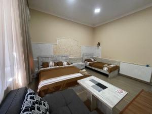 Voodi või voodid majutusasutuse Fazis Hotel toas