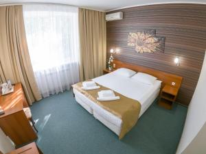 Ein Bett oder Betten in einem Zimmer der Unterkunft Hotel Zagreb
