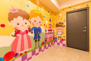 a bedroom with a castle and princess wall mural at 閣樂親子旅宿Kids Fun Hotel in Luodong