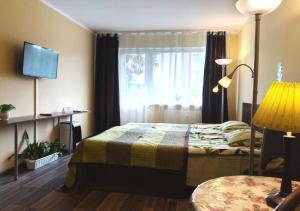 Кровать или кровати в номере Park Apartment Tallinn