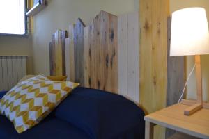Кровать или кровати в номере Agriostello Riparo