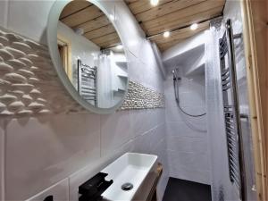 a bathroom with a sink and a mirror at AnchorageWells Holiday Cottage and King Ensuites Room Only in Wells next the Sea